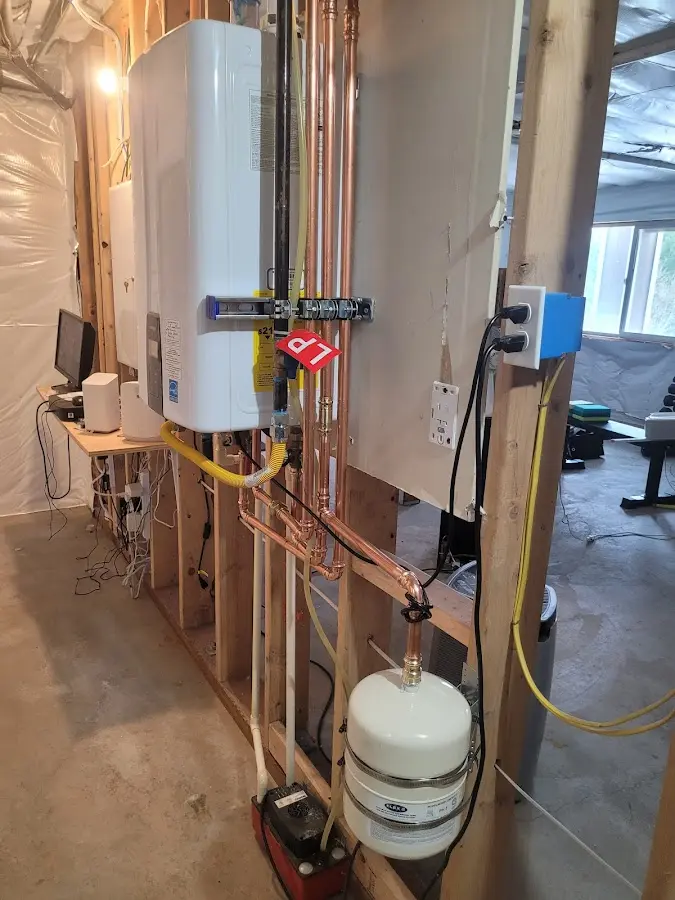 Licensed plumber repairing a kitchen sink in Morton